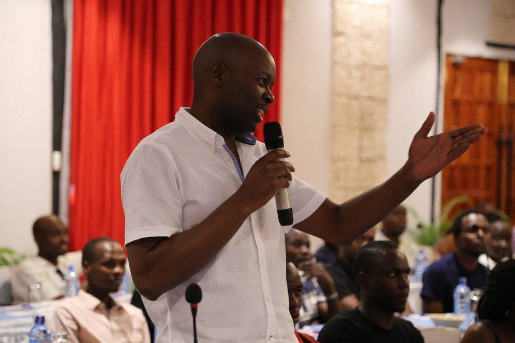 Dr Enos Masini introducing member of the National Taskforce during the closeout meeting